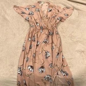 Nude floral dress with lace details and thigh slit